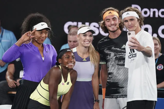 From left, Naomi Osaka of Japan, Coco Gauff of the United States, Caroline Wozniacki of Denmark, Stefanos Tsitsipas of Greece, and Alexander Zverev of Germany pose for a selfie during the Rally For Relief at Rod Laver Arena in Melbourne, Wednesday, January 15, 2020. Tennis stars have come together for the Rally for Relief to raise money in aid of the bushfire relief efforts across Australia. (Photo by Scott Barbour/AAP Image via AP Photo)