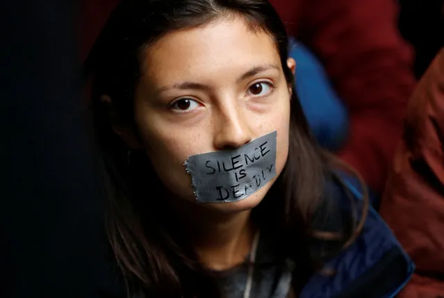 A protester with her mouth taped is pictured outside the BBC Headquarters during an Extinction Rebellion demonstration in London, Britain on October 11, 2019. (Photo by Peter Nicholls/Reuters)