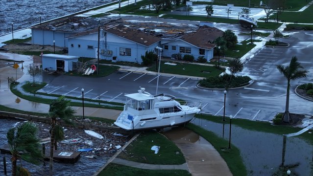 In this aerial view, a boat is washed ashore from when Hurricane Milton passed through the area on October 10, 2024, in Punta Gorda, Florida. The storm made landfall as a Category 3 hurricane in the Siesta Key area of Florida, causing damage and flooding throughout Central Florida. (Photo by Joe Raedle/Getty Images)