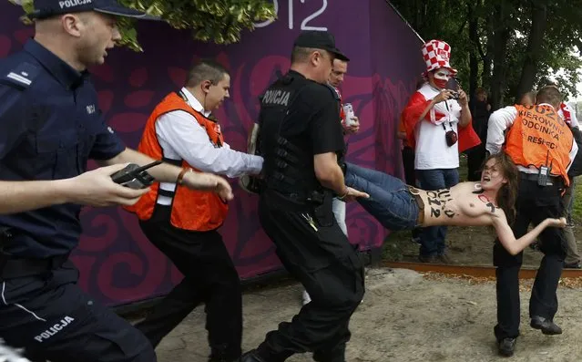 FEMEN Activists Strip In Protest Against EURO 2012
