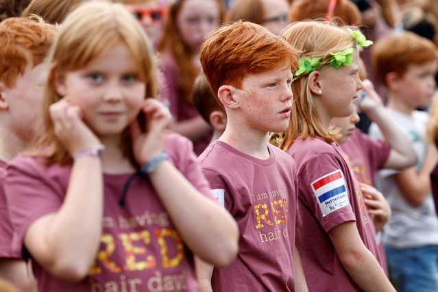 Children attend the annual Redhead Days Festival in Tilburg, Netherlands on August 27, 2023. (Photo by Piroschka van de Wouw/Reuters)