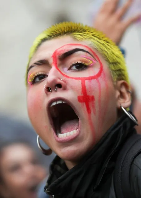 A woman takes part in a march during International Women's Day in Sao Paulo, Brazil on March 8, 2020. (Photo by Amanda Perobelli/Reuters)