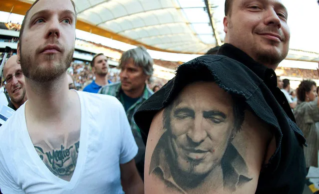 A Bruce Springsteen fan shows his tattoo at the opening concert of Springsteen's “Wrecking Ball” world tour at the Commerzbank Arena in Frankfurt, on May 25, 2012. (Photo by Thomas Lohnes/AP Photo)