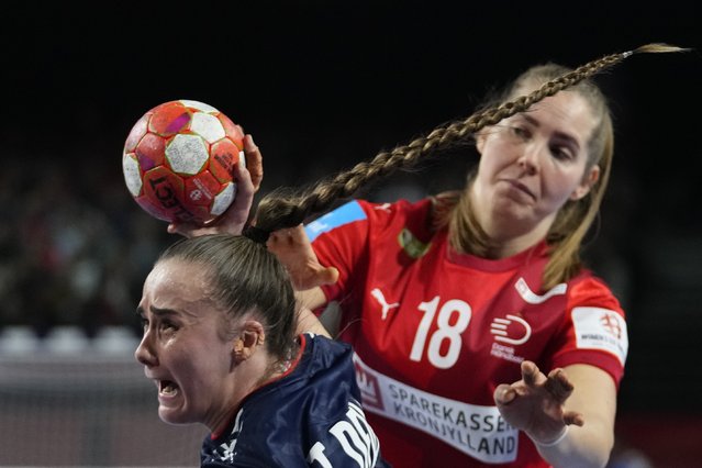 Norway's Thale Rushfeldt Deila, front, tries to score as Denmark's Mette Tranborg defends during the final match of the Women's European Handball Championship between Denmark and Norway, in Vienna, Austria, Sunday, December 15, 2024. (Photo by Petr David Josek/AP Photo)