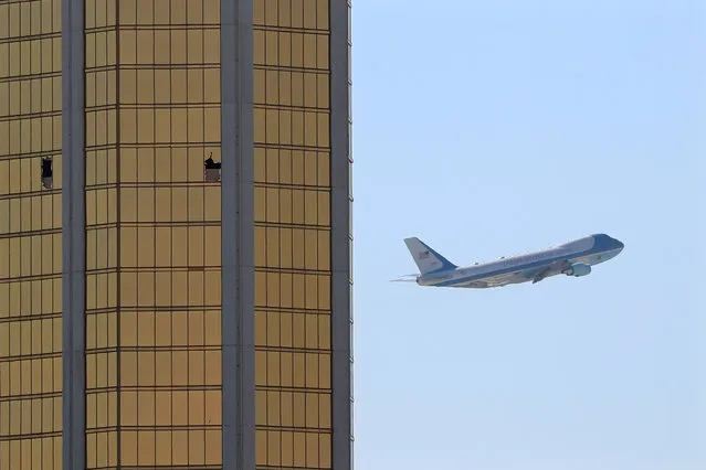 Air Force One departs Las Vegas past the broken windows on the Mandalay Bay hotel, where shooter Stephen Paddock conducted his mass shooting along the Las Vegas Strip in Las Vegas, Nevada, U.S., October 4, 2017. (Photo by Mike Blake/Reuters)