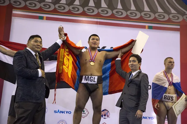 A Mongolian youth wins gold in the Men's Junior Competition during the 2016 World Sumo Championship on July 30, 2016 in Ulaanbaatar, Mongolia. (Photo by Taylor Weidman/Getty Images)