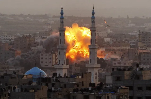 Smoke rises during an explosion from an Israeli forces strike in Gaza City, Saturday, November 17, 2012. Israel bombarded the Hamas-ruled Gaza Strip with nearly 200 airstrikes early Saturday, the military said, widening a blistering assault on Gaza rocket operations by militants to include the prime minister's headquarters, a police compound and a vast network of smuggling tunnels. (Photo Hatem Moussa/AP Photo)