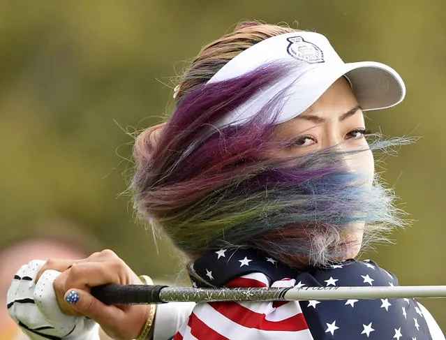 United States' Michelle Wie hits a ball in the singles on Day3 at the Solheim Cup golf tournament in St. Leon-Rot, southern Germany, Sunday, September 20, 2015. (Photo by Jens Meyer/AP Photo)