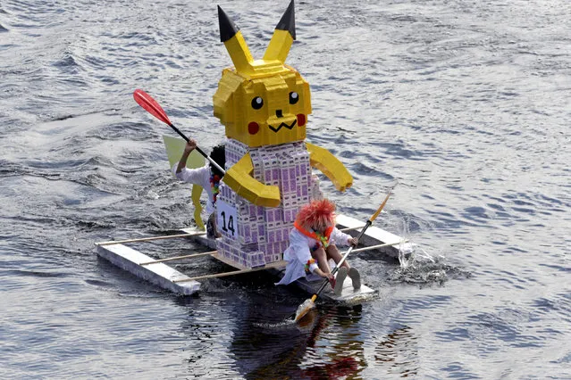 People navigate along the Lielupe river as they participate in the Milk Carton Boat Race in Jelgava, Latvia August 27, 2016. (Photo by Ints Kalnins/Reuters)