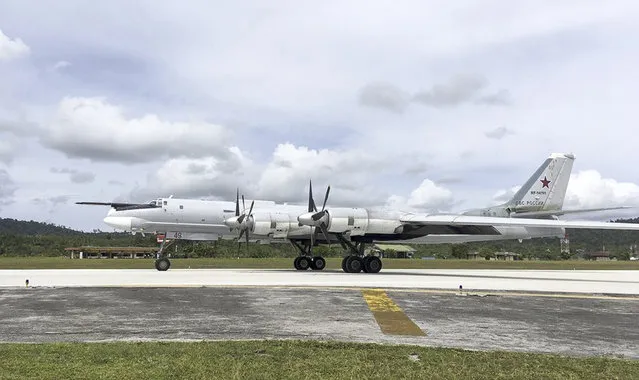 In this photo released by Russian Defense Ministry official web site Tuesday, December 5, 2017 shows A Russian Tu-95 bomber arrives on Biak Island in Indonesia. The visit by the bombers capable of carrying nuclear weapons seems to underline Russia's resurgent military might and its desire to expand its foothold around the world. (Photo by AP Photo/ Russian Defense Ministry Press Service)