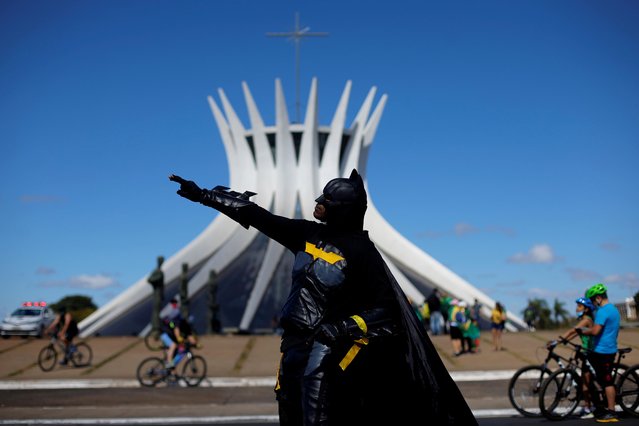 A protester dressed as comic book superhero Batman takes part in a protest in support of Brazilian President Jair Bolsonaro in front of the Brasilia Cathedral, amid the coronavirus disease (COVID-19) outbreak, in Brasilia, Brazil, July 19, 2020. (Photo by Adriano Machado/Reuters)