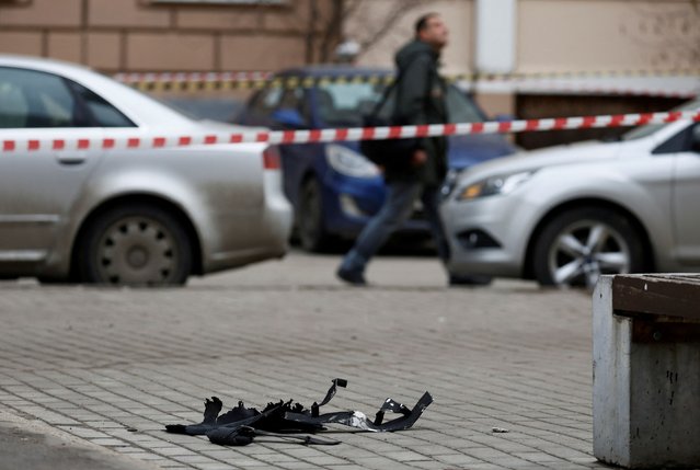 Debris lies on the ground next to a multi-storey residential building damaged in a recent Ukrainian drone attack, according to local authorities, in the course of Russia-Ukraine conflict, in Vidnoye, Moscow Region, Russia on March 11, 2025. (Photo by Reuters/Stringer)