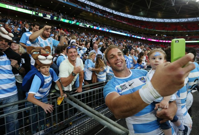 Rugby Union, New Zealand vs Argentina, IRB Rugby World Cup 2015 Pool C – Wembley Stadium, London, England on September 20, 2015: Argentina's Leonardo Senatore takes a selfie with fans at the end of the match. (Photo by Paul Childs/Reuters/Action Images)