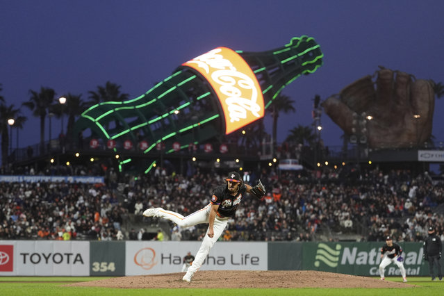 San Francisco Giants pitcher Jordan Hicks, foreground, works against the Milwaukee Brewers during the fifth inning of a baseball game in San Francisco, Tuesday, April 22, 2025. (Photo by Jeff Chiu/AP Photo)
