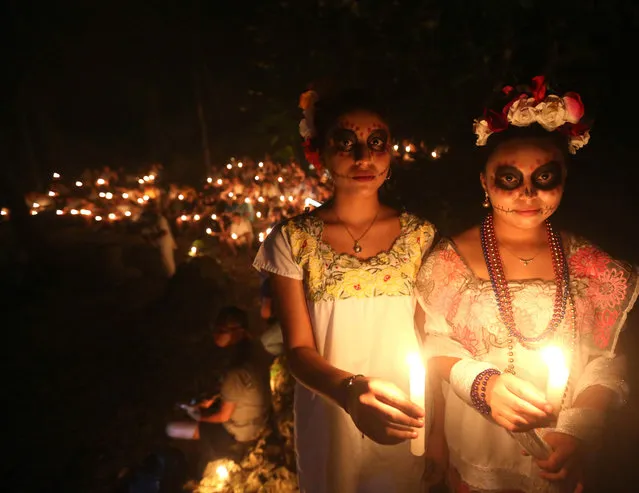 Indigenous women participate in the Hanal Pixan (Food of the Souls), in the community of Tres Reyes, Quintana Roo state, Mexico, 31 October 2022. With the Hanal Pixan, the celebration of the Day of the Dead begins Monday to remember people's loved ones in the State of Quintana. (Photo by Alonso Cupul/EPA/EFE)