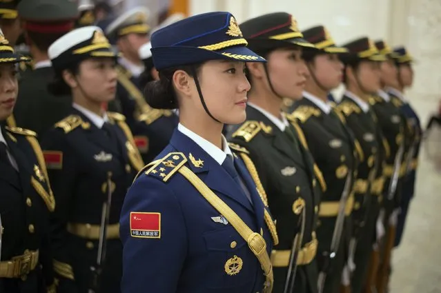 Members of the honour guard stand at attention, prior to a meeting between Chile's President Michelle Bachelet and Chinese President Xi Jinping at the Great Hall of the People in Beijing, November 12, 2014. (Photo by Fred Dufour/Reuters)