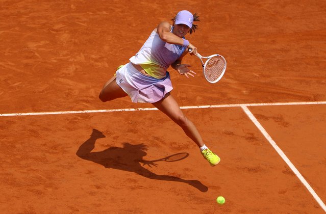 Poland's Iga Swiatek plays a backhand return to Ukraine's Elina Svitolina during their quarter-final women's singles match on day 10 of the French Open tennis tournament on Court Philippe-Chatrier at the Roland-Garros Complex in Paris on June 3, 2025. (Photo by Lisi Niesner/Reuters)