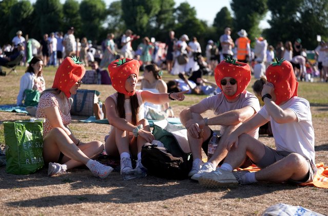 Spectators in the queue sporting strawberry hats on day one of the 2025 Wimbledon Championships at the All England Lawn Tennis and Croquet Club, London on Monday, June 30, 2025. (Photo by Mike Egerton/PA Images via Getty Images)