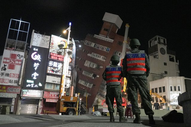Soldiers stand near the site where a building collapsed, following an earthquake, in Hualien, Taiwan on April 3, 2024. (Photo by Walid Berrazeg/Reuters)