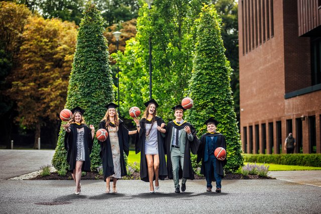 Holly Kierans, Sophie Moore, Sabhbh Edwards Murphy, Eoghan Donaghy and Conor Coughlan graduate from the University of Limerick in southwest Ireland on August 31, 2025. The student basketball players were all on sports scholarships. (Photo by Brian Arthur Photo)