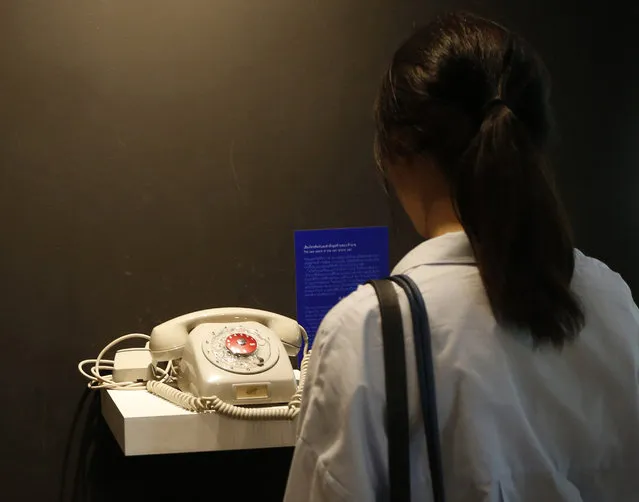 In this Wednesday, June 7, 2017, photo, the office phone over which an employee heard that her bankrupt boss had killed himself is part of an exhibition marking the 20th anniversary of the Asian financial crisis at the Museum Siam in Bangkok. Asian governments and economies have recovered from the financial meltdown that spread through much of Asia 20 years ago, but many in people Thailand, the epicenter of the crisis, recall painful memories of living through it and lost everything. (Photo by Sakchai Lalit/AP Photo)