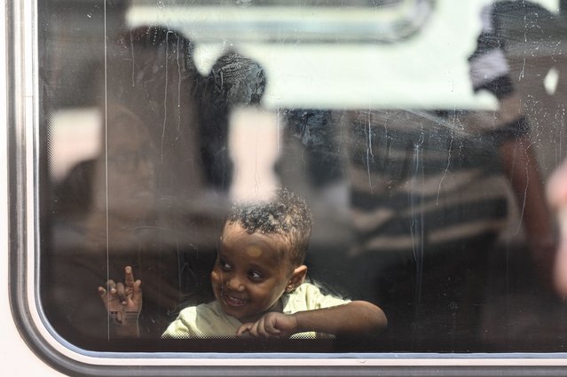 Sudanese refugees voluntarily return from Egypt to Sudan on a special train, coordinated by the Egyptian government, transporting them from Ramses Station in Cairo to Aswan, Egypt on August 3, 2025 in Cairo, Egypt. A free train service is running between the Egyptian capital of Cairo to the southern city of Aswan, where people can then board cross-border buses to the Sudanese capital of Khartoum, as part of a voluntary repatriation program for Sudanese nationals who have been displaced by the conflict in Sudan. The repatriation service comes after Sudanese armed forces regained territory around the capital from the paramilitary Rapid Support Forces (RSF), bringing a relative period of calm since the start of the civil war in April 2023. (Photo by Sayed Hassan/Getty Images)