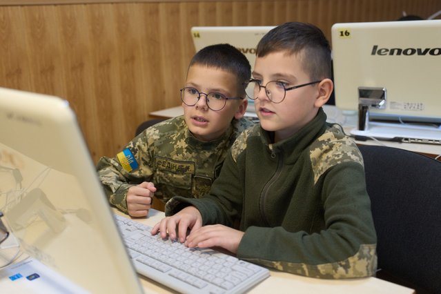 Youths attend a cadet lyceum in Kyiv, Ukraine, Wednesday, October 8, 2025. (Photo by Efrem Lukatsky/AP Photo)