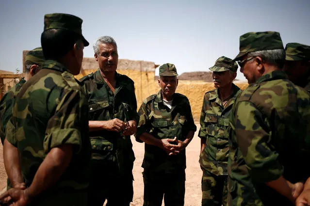 Second sector commander Sidi Waghal (3rd L) speaks to his officers at the forces base on the outskirts of Tifariti, in Western Sahara, September 9, 2016. (Photo by Zohra Bensemra/Reuters)