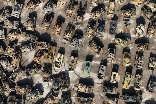An aerial photo taken on November 27, 2025 in the countryside of the northern Syrian city of Idlib shows a cemetery of army tanks and armoured vehicles that were confiscated by rebel forces during the fall of the regime of former Syrian president Bashar al-Assad. December 8 will mark the first anniversary of the ouster of Syria's longtime ruler Bashar al-Assad. (Photo by Abdulaziz Ketaz/AFP Photo via Getty Images)