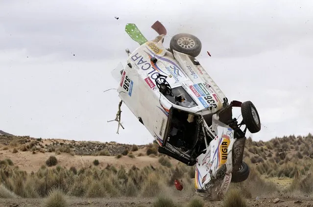 Argentine Juan Manuel Silva and Pablo Sisterna (not pictured) crash in their Mercedes car during the 7th stage of the Dakar Rally from Iquique to Uyuni, January 10, 2015. (Photo by Daniel Rodrigo/Reuters)