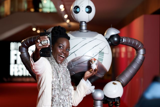 Roz and actress Lupita Nyong'o attend “The Wild Robot” Headline Gala during the 68th BFI London Film Festival at The Royal Festival Hall on October 13, 2024 in London, England. (Photo by Shane Anthony Sinclair/Getty Images for BFI)