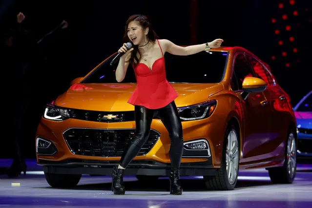 Hong Kong singer G.E.M. performs in front of Curze RS car shown at a Chevrolet event in Guangzhou, China, November 17, 2016. (Photo by Bobby Yip/Reuters)