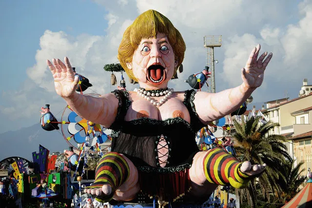 A giant papier-mache float depicting German Chancellor Angela Merkel moves through the streets of Viareggio during the traditional Carnival of Viareggio parade on February 1, 2015 in Viareggio, Italy. The Carnival of Viareggio is considered one of the most important carnivals in Italy and is characterised by its giant papier-mache floats depicting caricatures of popular characters, politicians and fictional creations. (Photo by Laura Lezza/Getty Images)