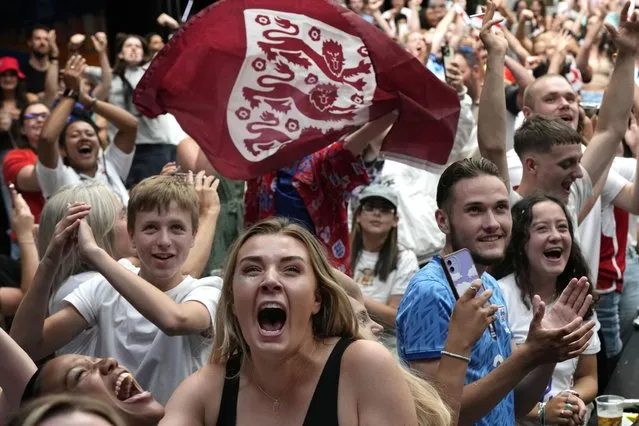 England fans react as England win their match, as they watch a screening of the Women's World Cup 2023 semifinal soccer match between England and Australia at BOXPARK Wembley in London, Wednesday, August 16, 2023. England will play Spain in the final of the Women's World Cup on Sunday after beating co-hosts Australia 3-1 in the semi-final in Sydney.(Photo by Frank Augstein/AP Photo)