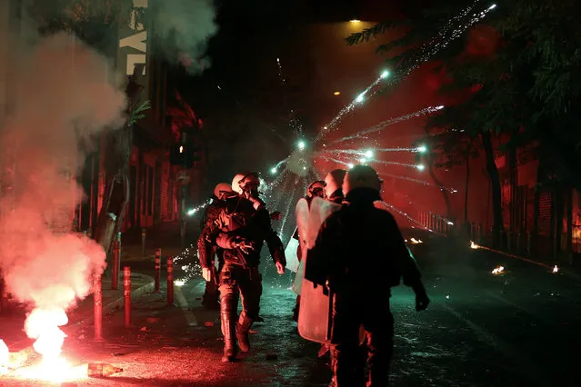 Fireworks explode next to riot police during clashes following an anniversary rally marking the 2008 police shooting of 15-year-old student, Alexandros Grigoropoulos, in Athens, Greece, December 6, 2016. (Photo by Alkis Konstantinidis/Reuters)