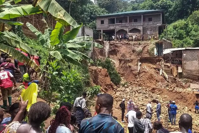 A general scene of destruction caused by a landslide in the district of Mbankolo, northwest of Yaounde, on October 9, 2023. At least 27 people have been killed after heavy rains caused a section of a hillside covered in precariously built houses to collapse in Cameroon's capital Yaounde. Rescuers were still searching for victims after the landslide that happened on the evening of October 8, 2023. Landslides are frequent during the rainy season in Yaounde, a city of nearly three million people, where often precarious dwellings are built on its many hills. (Photo by Romuald Nkonlak/AFP Photo)