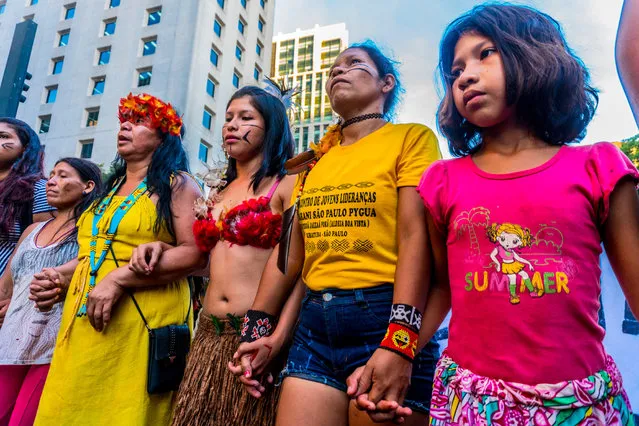 Indigenous people of various ethnic groups protest calling for demarcation of lands during the closing of the “Red January – Indigenous Blood”, in Paulista Avenue, in São Paulo, Brazil on January 31, 2019. People all over the world protest against the anti-indigenous policies of the new Brazilian President Jair Bolsonaro. (Photo by Cris Faga/Rex Features/Shutterstock)