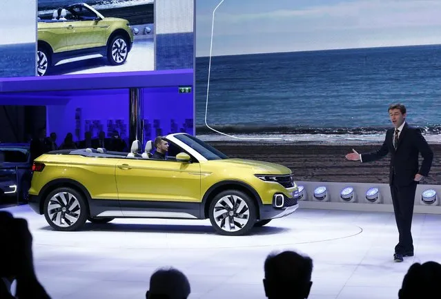 Frank Welsch, member of the board of Volkswagen Brand, presents a Volkswagen T-Cross Breeze car during its w orld premiere at the 86th International Motor Show in Geneva, Switzerland, March 1, 2016. (Photo by Denis Balibouse/Reuters)