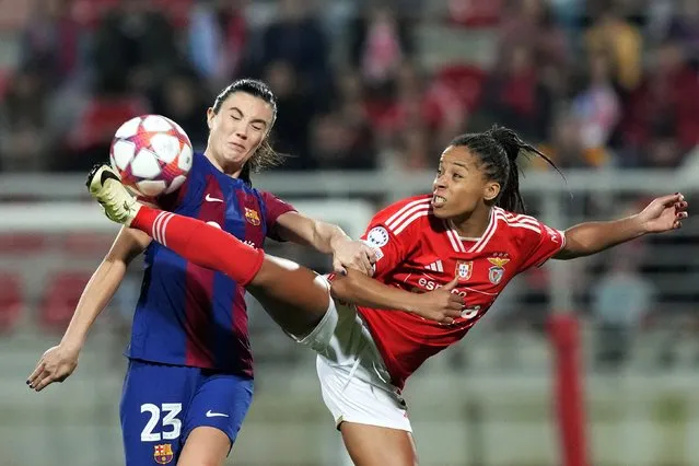 Benfica's Jessica Silva, right, fights for the ball with Barcelona's Ingrid Syrstad Engen during the women's Champions League group A soccer match between SL Benfica and FC Barcelona at the Benfica Campus in Seixal, outside Lisbon, Wednesday, January 31, 2024. (Photo by Armando Franca/AP Photo)