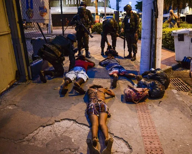 Members of the Brazilian army check people as they patrol the streets of Vitoria, Espirito Santo State, Brazil, 06 February 2017. The capital of the southeastern Brazilian state of Espirito Santo has reportedly experienced 52 homicides since the police went on strike at the end of last week, a union leader said. Police stopped patrolling the streets of the city on 04 February, to protest the state government's failure to invest in public safety and to value law enforcement personnel, Jorge Emiliano Legal said. Crime has surged in Vitoria, the state capital, with a record 52 violent deaths in three days, Legal said. (Photo by Gabriel Lordello/EPA)