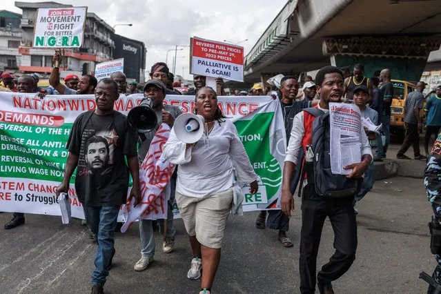 Protestors march with placards and banners during the Joint Action Front (JAF) and the Coalition for Revolution (CORE) nationwide protest against the government policies of Nigerian President Bola Tinubu in Lagos on February 26, 2024. (Photo by Benson Ibeabuchi/AFP Photo)