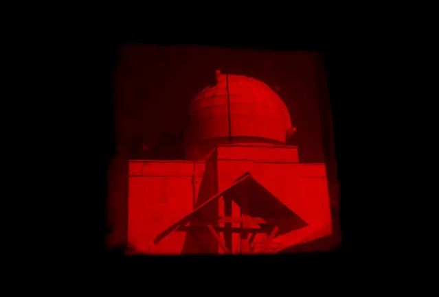 A solar tunnel telescope dome is seen through a darkroom at the Kodaikanal Solar Observatory, India, February 4, 2017. (Photo by Danish Siddiqui/Reuters)