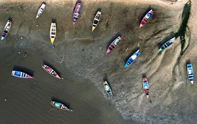 A drone view shows boats at Cardo Beach in Sepetiba Bay, in Rio de Janeiro, Brazil, on March 20, 2024. (Photo by Ricardo Moraes/Reuters)