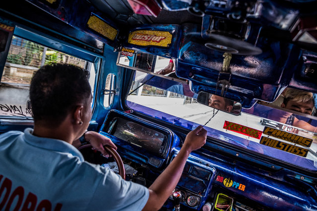 Although the government have announced a seven-year payment plan, plus a subsidy of 80,000 PHP so that drivers can change vehicles, drivers like John Paul are worried about the cost. John Paul’s daily pay is currently around 500 to 1000 PHP, while a new jeep would work out at around 600 PHP a day. (Photo by Claudio Sieber/Barcroft Media)
