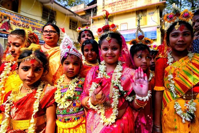 Young girls poses for a Group Photo after the Ritual of Kumari Puja at the Adyapith temple on April 17, 2024. Kumari Puja is an Indian Hindu Tradition mainly celebrated during the Durga Puja according to the Hindu calendar. Kumari describes a young virgin girl from the age of 1 to 16 who is getting worshipped by their mothers according to Hindu mythology. It is believed that Kumari Puja grants many blessings to the worshipers and the little girl. With this, the devotees believe that the goddess will help them overcome all the dangers in life and will empower them in handling stress and obstructions in life. (Photo by Avishek Das/SOPA Images/Rex Features/Shutterstock)