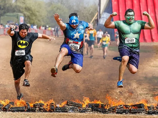 Runners participate in Warrior Dash, World's Largest Obstacle Race Series on March 22, 2014 in Smithville, Texas. (Photo by Rick Kern/Getty Images for Warrior Dash)