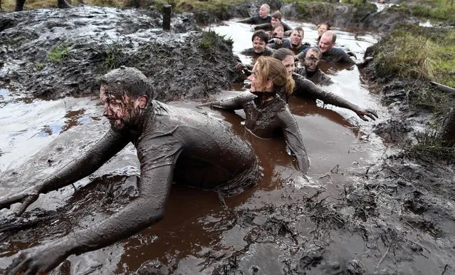 Competitors take part in the Mud Madness off-road challenge event at Foymore Lodge, Portadown in Northern Ireland on April 17, 2016. (Photo by Paul Faith/AFP Photo)