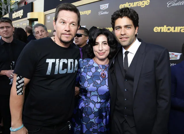 Mark Wahlberg, Sue Kroll, President of Worldwide Marketing and International Distribution at Warner Bros., and Adrian Grenier seen at Warner Bros. Premiere of "Entourage" held at Regency Village Theatre on Monday, June 1, 2015, in Westwood, Calif. (Photo by Eric Charbonneau/Invision for Warner Bros./AP Images)