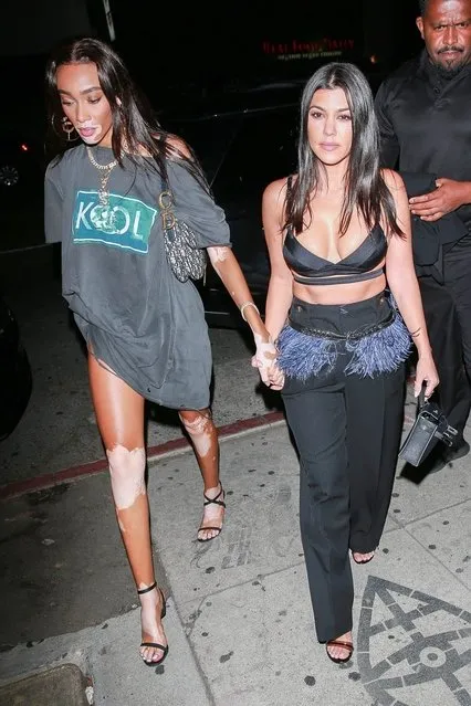 Kourtney Kardashian, Winnie Harlow, and Luka Sabbat arrive at The Nice Guy in West Hollywood, CA. on July 10, 2019. Kourtney and Winnie strut into the venue hand in hand while Luka entered solo. (Photo by Backgrid USA)