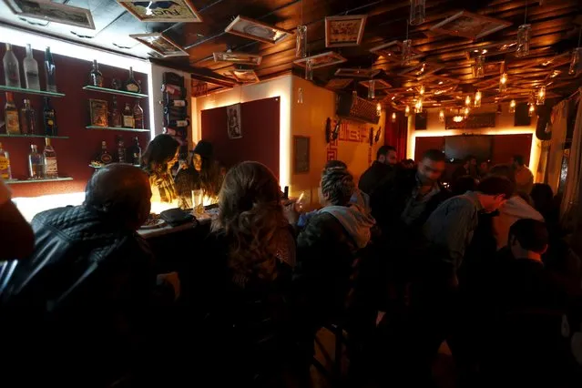 People spend time at 80s Bar in Damascus, Syria, March 11, 2016. (Photo by Omar Sanadiki/Reuters)